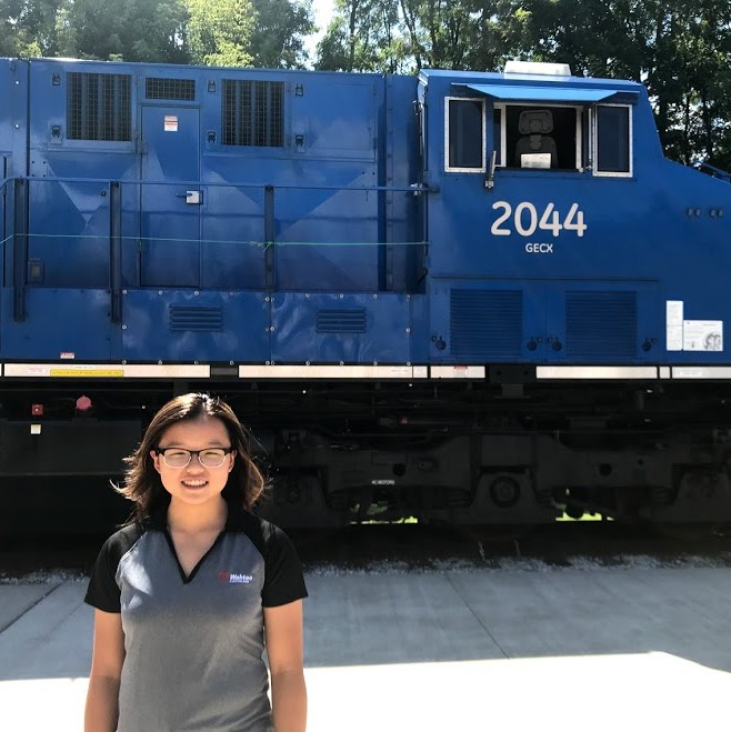 Megan and a GE locomotive